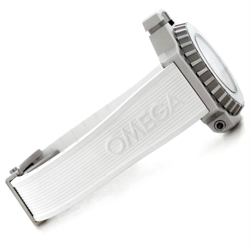 The image shows a side view of an Omega Ploprof 224.32.55.21.04.001 Men's Stainless Steel White Dial 224.32.55.21.04.001 Men's Stainless Steel White Dial watch, highlighting the case, bezel, and branded strap.