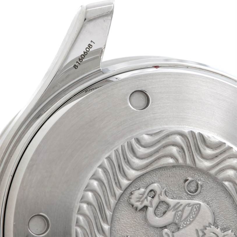 The image shows a close-up of the back case of an Omega Seamaster 2599.80.00 Men
s Stainless Steel Blue Dial 2599.80.00 Men
s Stainless Steel Blue Dial watch, highlighting its engraved design and serial number.