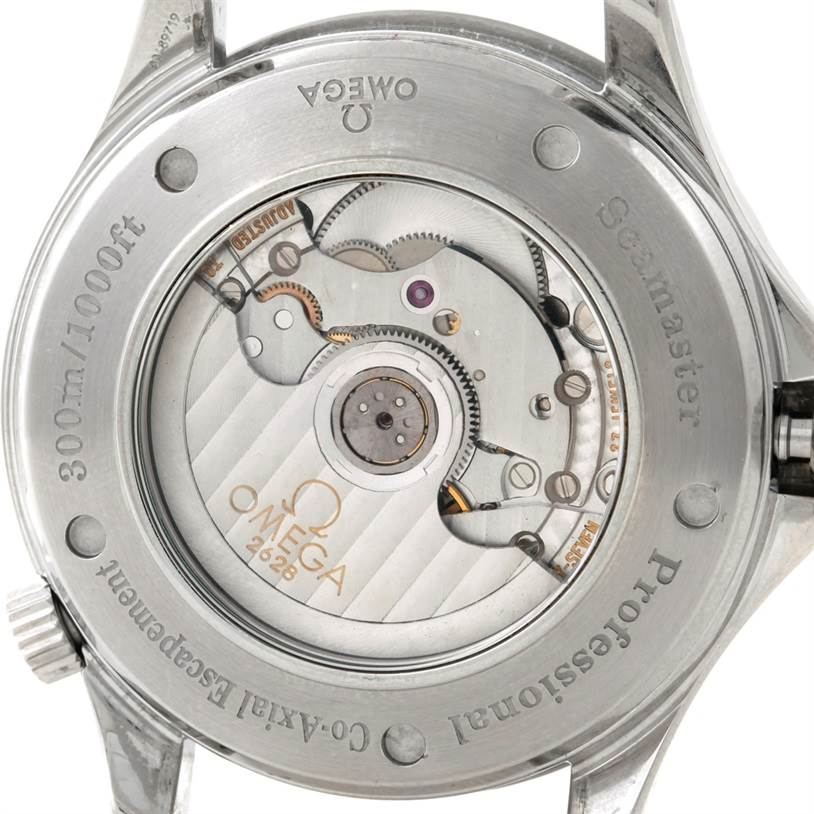 The image shows the back view of an Omega Seamaster 2535.80.00 Men
s Stainless Steel Blue Dial 2535.80.00 Men
s Stainless Steel Blue Dial watch, highlighting its movement and engraved details.