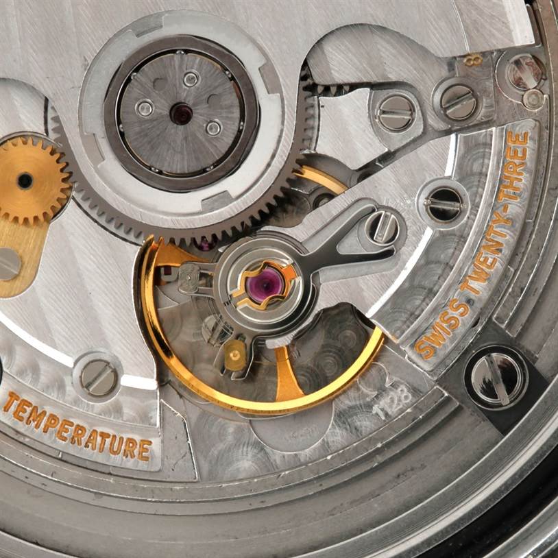This close-up image shows the intricate movement and gears of the Omega Seamaster 2538.20.00 Men
s Stainless Steel White Dial 2538.20.00 Men
s Stainless Steel White Dial watch
s mechanism.