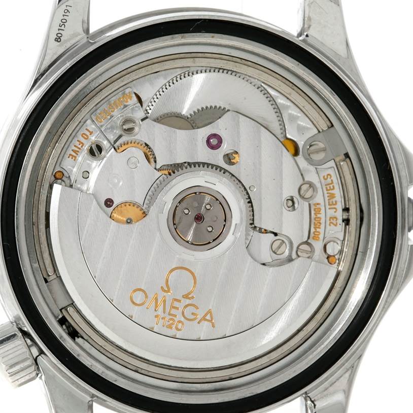 The image shows the open back view of the movement mechanism in an Omega Seamaster Men
s Stainless Steel Blue Dial Men
s Stainless Steel Blue Dial watch.