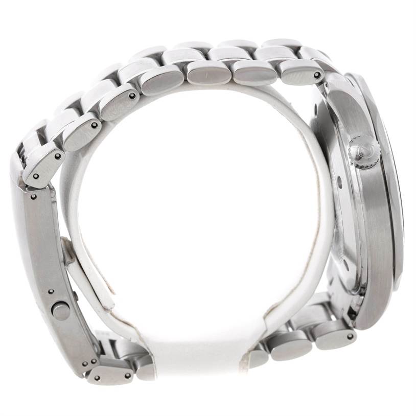 The image shows a side view of an Omega Seamaster 2064.50.00 Men
s Stainless Steel Black Dial 2064.50.00 Men
s Stainless Steel Black Dial watch, focusing on its metallic band and crown.