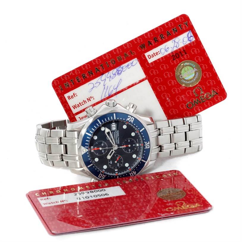 The Omega Seamaster 2599.80.00 Men
s Stainless Steel Blue Dial 2599.80.00 Men
s Stainless Steel Blue Dial watch is shown with its face and metal bracelet at an angle, along with its warranty cards.