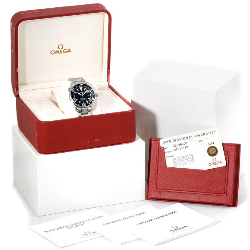 The image shows an Omega Seamaster 2262.50.00 Men's Stainless Steel Black Dial 2262.50.00 Men's Stainless Steel Black Dial watch in its open case, accompanied by an international warranty card and documents.
