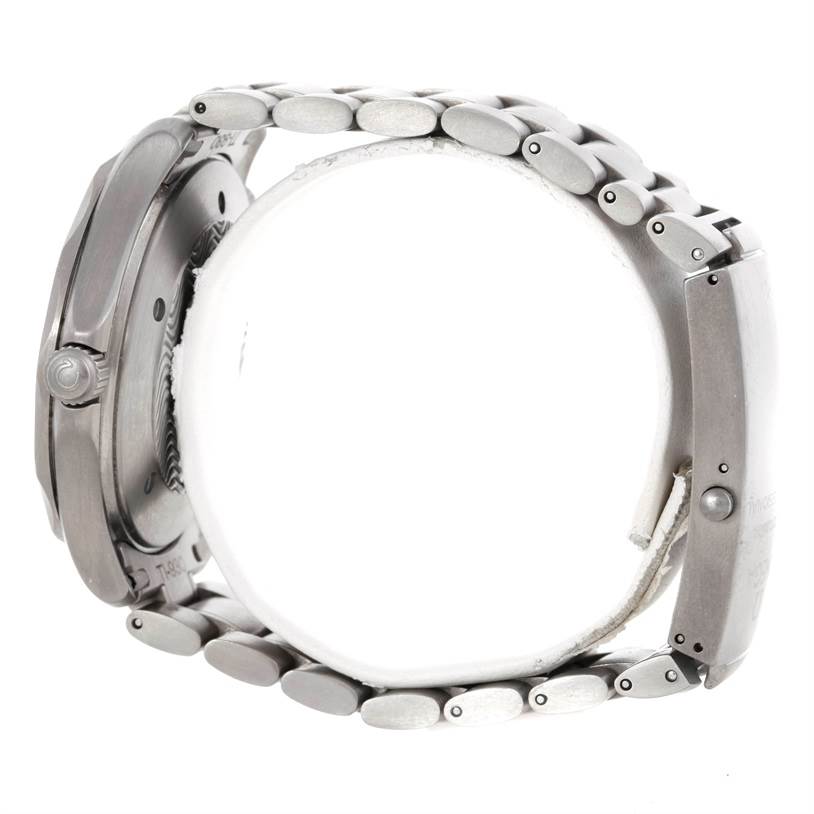 The image shows a side view of an Omega Seamaster 2231.80.00 Men
s Titanium Blue Dial 2231.80.00 Men
s Titanium Blue Dial watch, displaying the side of the case, the crown, and the bracelet.