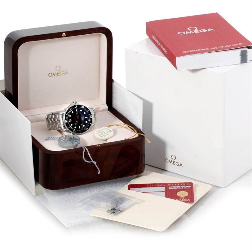 The Omega Seamaster 212.30.41.20.01.001 Men
s Stainless Steel Black Dial 212.30.41.20.01.001 Men
s Stainless Steel Black Dial watch is displayed in an open box with accessories, manuals, and warranty cards around it.