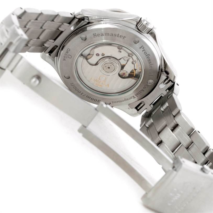 The image shows the back of the Omega Seamaster 2535.80.00 Men's Stainless Steel Blue Dial 2535.80.00 Men's Stainless Steel Blue Dial watch, revealing its automatic movement and part of the metal bracelet.