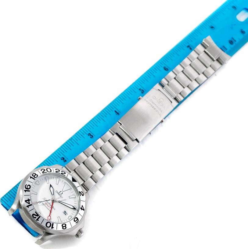 The image shows an Omega Seamaster 2538.20.00 Men
s Stainless Steel White Dial 2538.20.00 Men
s Stainless Steel White Dial watch, face up, laid alongside a blue ruler for measurement.