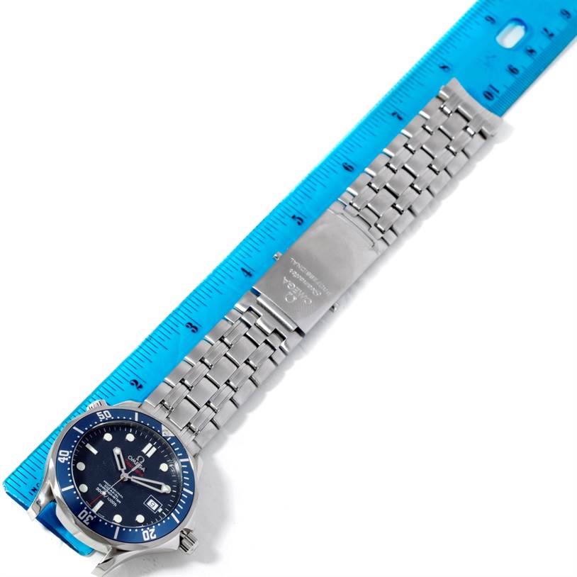 The image shows an Omega Seamaster 2220.80.00 Men's Stainless Steel Blue Dial 2220.80.00 Men's Stainless Steel Blue Dial watch lying flat with a blue ruler for scale.