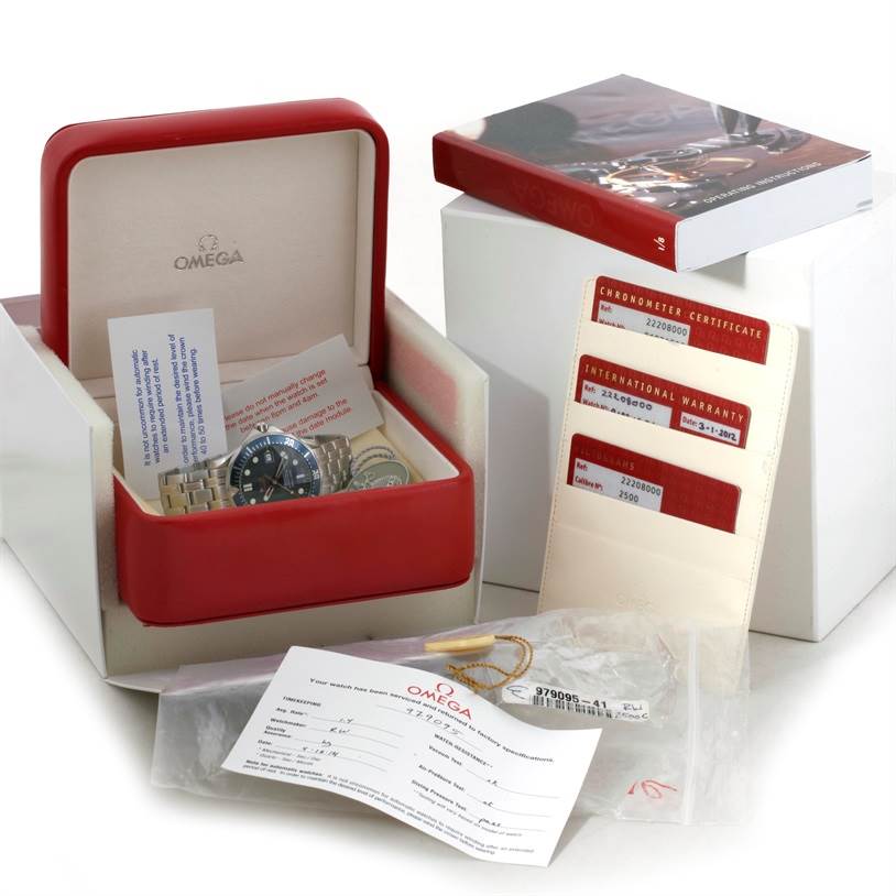 The image shows an Omega Seamaster 2220.80.00 Men's Stainless Steel Blue Dial 2220.80.00 Men's Stainless Steel Blue Dial watch in its box with related accessories, manuals, and certification documents.