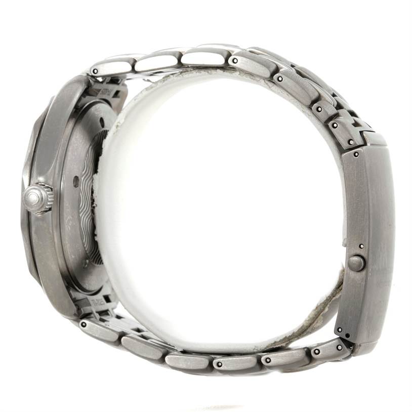 The image shows a side profile of an Omega Seamaster 2031.50.00 Men's Titanium Black Dial 2031.50.00 Men's Titanium Black Dial watch, highlighting the crown, case, and metal bracelet.