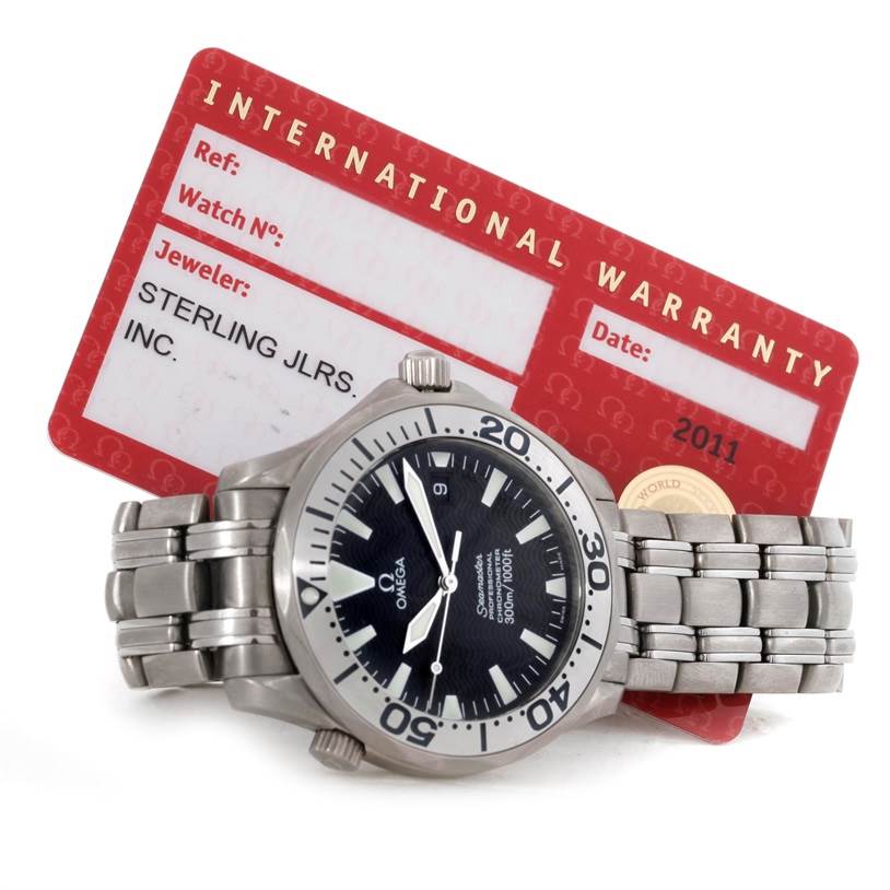 The image shows an Omega Seamaster 2031.50.00 Men's Titanium Black Dial 2031.50.00 Men's Titanium Black Dial watch face, bezel, and bracelet, along with an international warranty card.