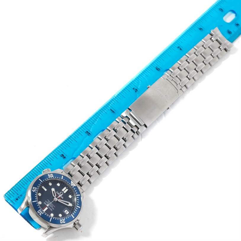 The Omega Seamaster 2222.80.00 Men's Stainless Steel Blue Dial 2222.80.00 Men's Stainless Steel Blue Dial watch is shown from a top-down angle, with the face, bezel, and full metal bracelet visible alongside a ruler.