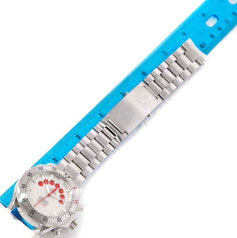 This image shows the Omega Seamaster 2595.30.00 Men
s Stainless Steel Silver Dial 2595.30.00 Men
s Stainless Steel Silver Dial watch laid flat with its stainless steel bracelet fully extended alongside a ruler.