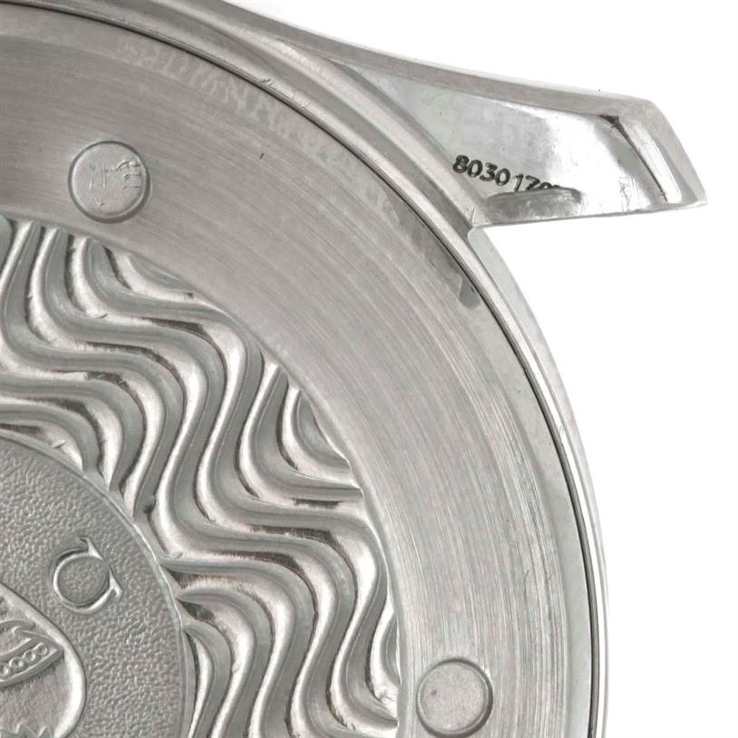 The image shows a close-up of the case back of an Omega Seamaster 2531.80.00 Men
s Stainless Steel Blue Dial 2531.80.00 Men
s Stainless Steel Blue Dial watch, highlighting its engraved design and serial number.