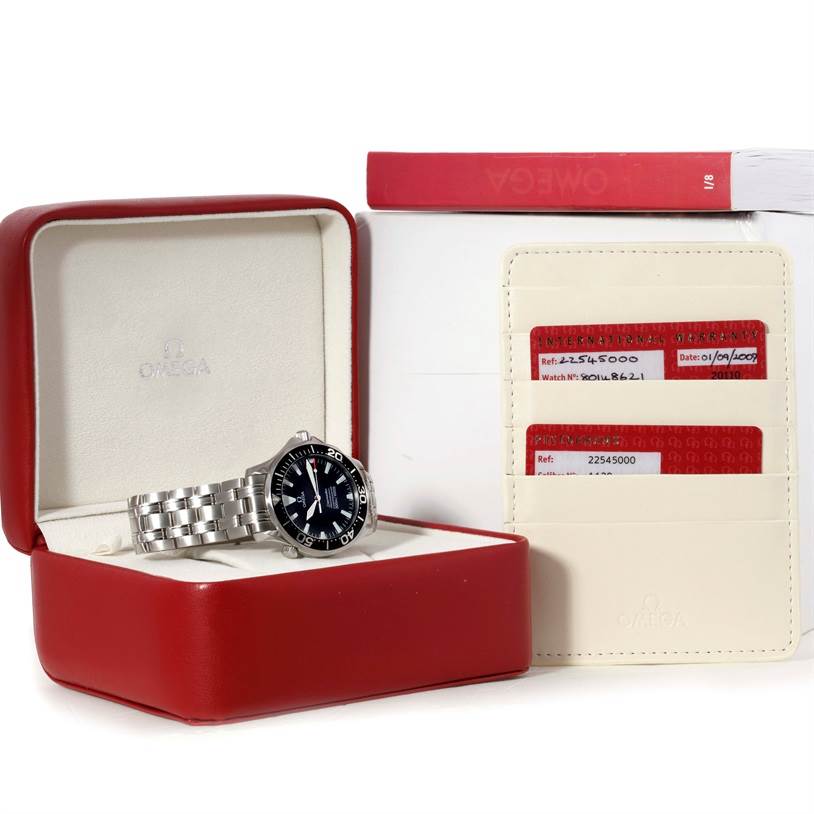 The Omega Seamaster 2254.50.00 Men
s Stainless Steel Black Dial 2254.50.00 Men
s Stainless Steel Black Dial watch is displayed in its open case, with accompanying documentation and cards visible alongside it.