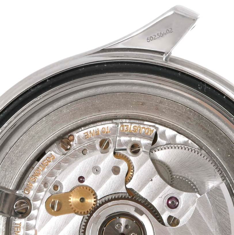 This image shows a detailed view of the movement and inner mechanism of an Omega Seamaster 2531.80.00 Men
s Stainless Steel Blue Dial 2531.80.00 Men
s Stainless Steel Blue Dial watch, focusing on the gears and inscriptions.