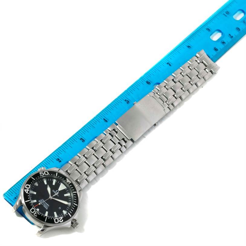 The image shows an Omega Seamaster 2264.50.00 Men
s Stainless Steel Black Dial 2264.50.00 Men
s Stainless Steel Black Dial watch laid flat, measured against a blue ruler, detailing the face, bezel, and metal bracelet.