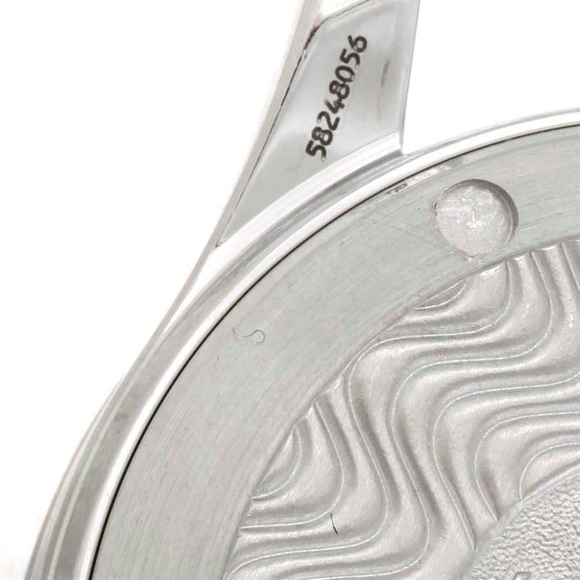 This image shows a close-up of the case back and part of the serial number of an Omega Seamaster 2262.50.00 Men
s Stainless Steel Black Dial 2262.50.00 Men
s Stainless Steel Black Dial watch.