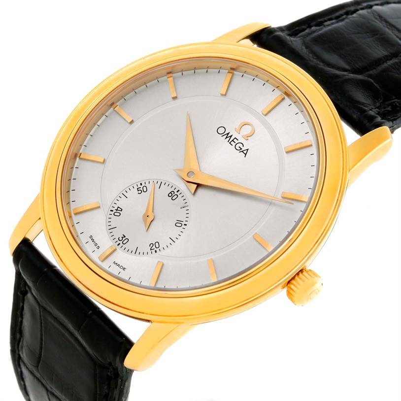 This image shows a slight side angle view of an Omega De Ville 4620.31 Men's Yellow Gold Silver Dial 4620.31 Men's Yellow Gold Silver Dial watch, highlighting its gold casing and black leather strap.
