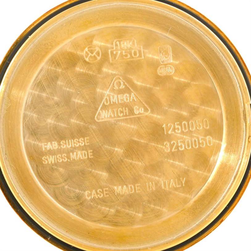 This image shows the interior case back of an Omega De Ville 4620.31 Men's Yellow Gold Silver Dial 4620.31 Men's Yellow Gold Silver Dial model watch labeled with brand and manufacturing details.