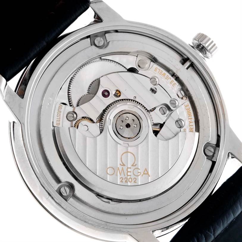 The image shows the back side of an Omega De Ville 4813.30.01 Men's Stainless Steel Silver Dial 4813.30.01 Men's Stainless Steel Silver Dial watch with an open view of its mechanical movement.