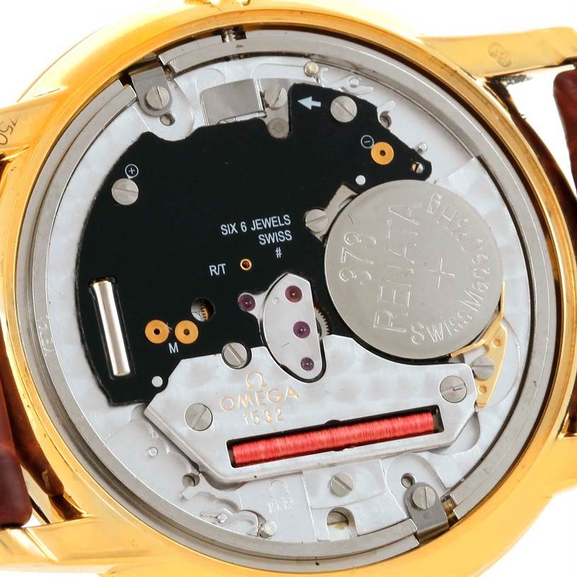 This image shows the inner workings and movement of an Omega De Ville Men's Yellow Gold Silver Dial Men's Yellow Gold Silver Dial watch, including the battery and internal components.