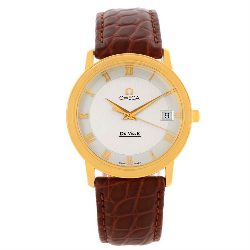 This is a front view of an Omega De Ville Men's Yellow Gold Silver Dial Men's Yellow Gold Silver Dial watch showing its face, golden bezel, and brown leather strap.