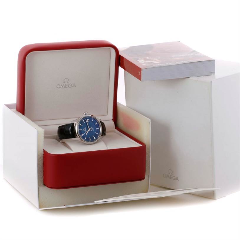The image shows an Omega De Ville 431.33.41.21.03.001 Men's Stainless Steel Blue Dial 431.33.41.21.03.001 Men's Stainless Steel Blue Dial watch with a blue face inside its open red and white display box.
