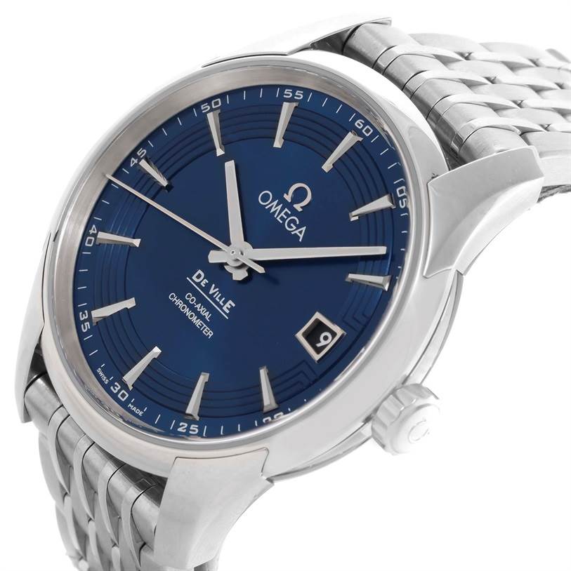 The image shows a close-up, angled view of the Omega De Ville 431.33.41.21.03.001 Men's Stainless Steel Blue Dial 431.33.41.21.03.001 Men's Stainless Steel Blue Dial watch, highlighting the blue dial, date window, and stainless steel strap.