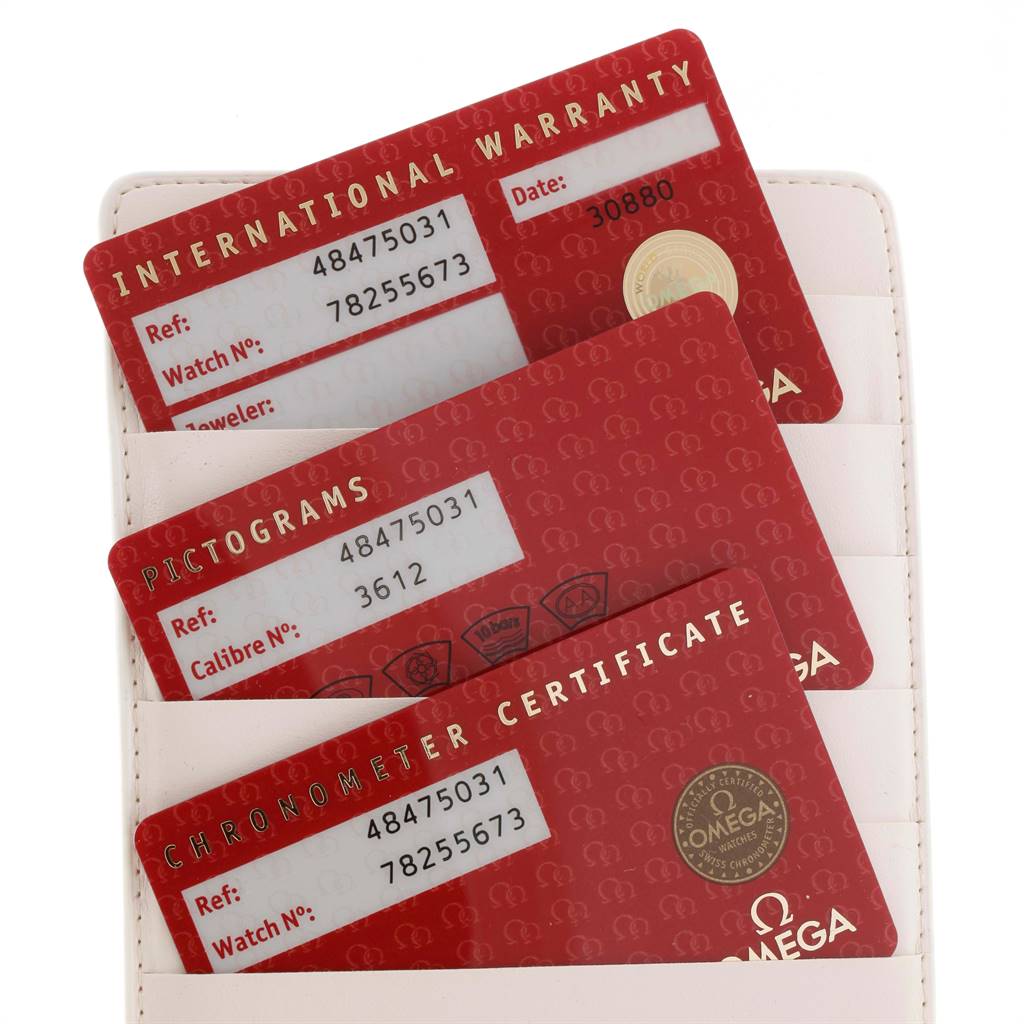 The image shows International Warranty, Pictograms, and Chronometer Certificate cards for an Omega De Ville 4847.50.31 Men's Stainless Steel Black Dial 4847.50.31 Men's Stainless Steel Black Dial watch.