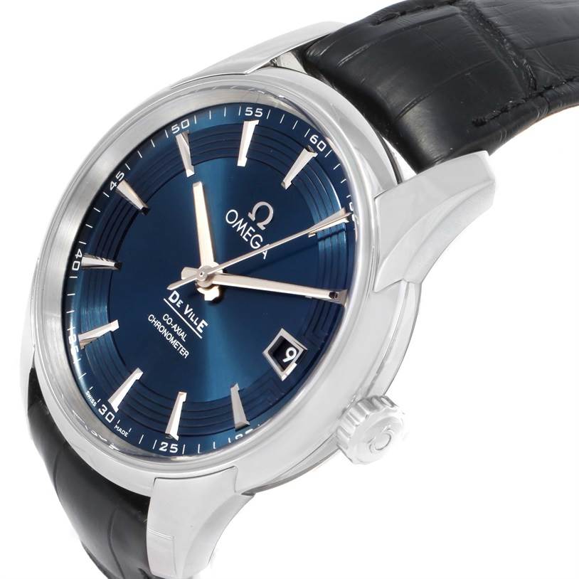 The image shows a close-up, angled view of the Omega De Ville 431.33.41.21.03.001 Men's Stainless Steel Blue Dial 431.33.41.21.03.001 Men's Stainless Steel Blue Dial watch, highlighting its blue dial, case, crown, and part of the strap.