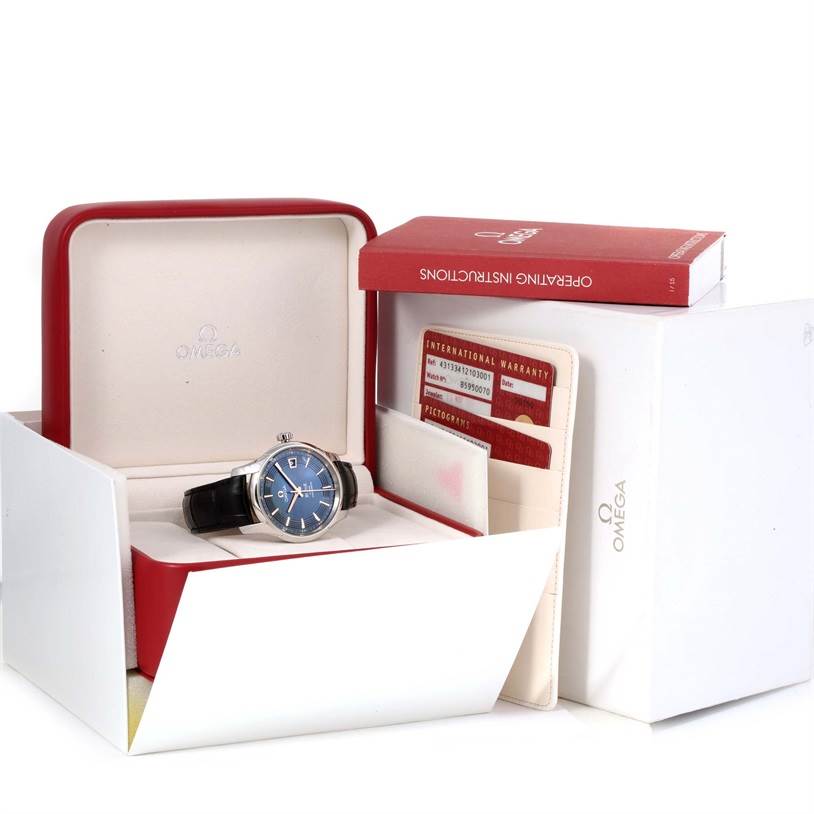 This image shows an Omega De Ville 431.33.41.21.03.001 Men's Stainless Steel Blue Dial 431.33.41.21.03.001 Men's Stainless Steel Blue Dial watch in a box, accompanied by the user manual and warranty cards.