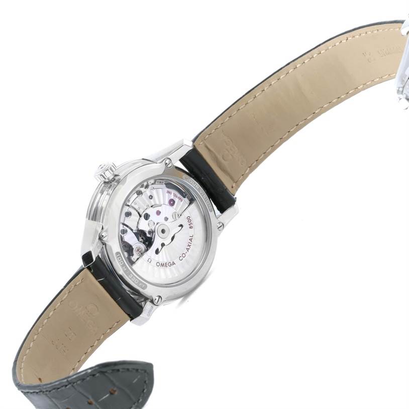 The image shows the back view of the Omega De Ville 431.33.41.21.03.001 Men's Stainless Steel Blue Dial 431.33.41.21.03.001 Men's Stainless Steel Blue Dial, displaying its inner mechanism and leather strap.