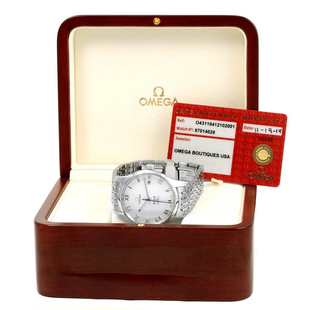 The Omega De Ville 431.10.41.21.02.001 Men's Stainless Steel Silver Dial 431.10.41.21.02.001 Men's Stainless Steel Silver Dial watch is displayed inside its box at an angle, along with its warranty card.