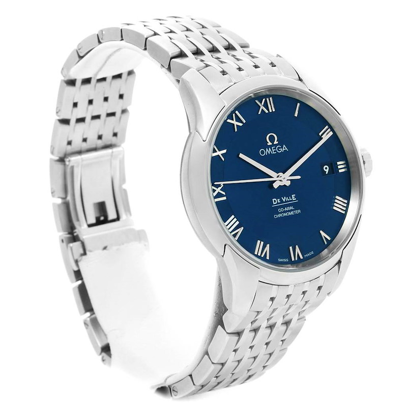 The image shows an Omega De Ville watch at a three-quarter angle, highlighting its blue dial, Roman numerals, and metal bracelet.