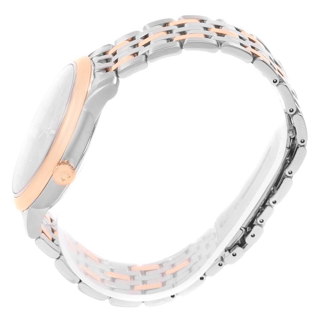 The image shows a side view of an Omega De Ville 424.20.40.20.13.001 Men's Steel and Gold (two tone) Brown Dial 424.20.40.20.13.001 Men's Steel and Gold (two tone) Brown Dial watch, focusing on the crown and metal bracelet.