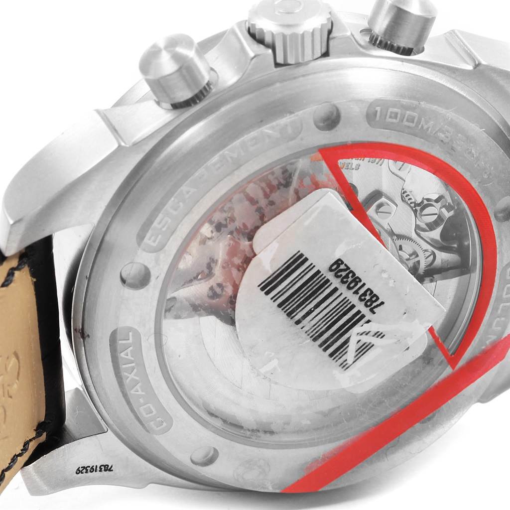 This image shows the back case and crown of the Omega De Ville 4851.61.31 Men's Stainless Steel Red Dial 4851.61.31 Men's Stainless Steel Red Dial watch, highlighting the Co-Axial movement and leather strap.