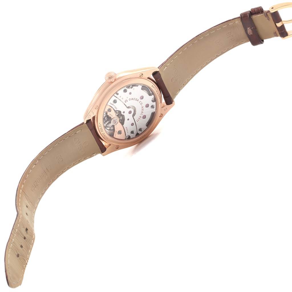 The image shows the back view of the Omega De Ville 432.53.40.21.02.002 Men's Rose Gold Silver Dial 432.53.40.21.02.002 Men's Rose Gold Silver Dial watch, highlighting its inner mechanism and leather strap.