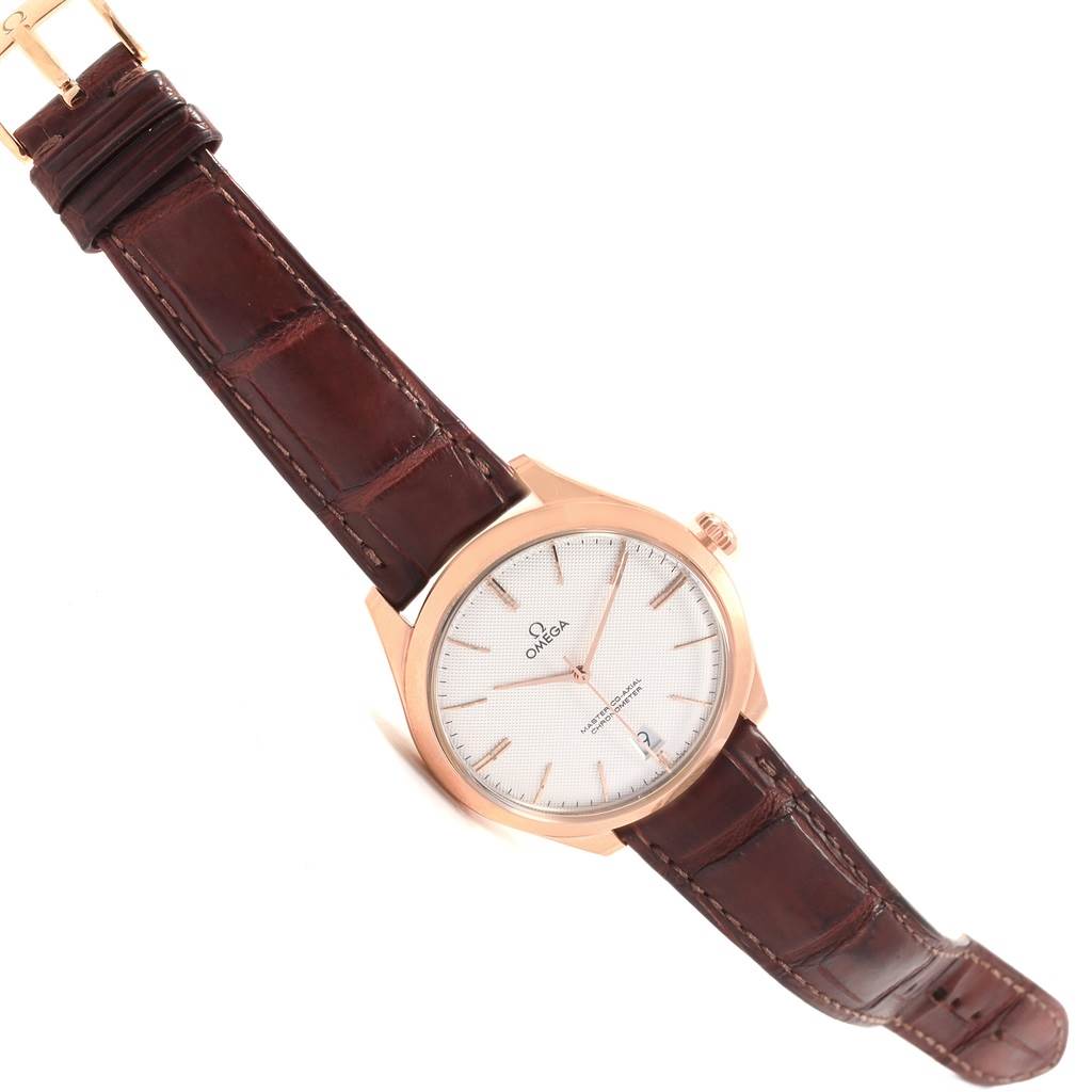 The image shows an Omega De Ville 432.53.40.21.02.002 Men's Rose Gold Silver Dial 432.53.40.21.02.002 Men's Rose Gold Silver Dial watch, angled slightly to showcase the dial, brown leather strap, and gold case.