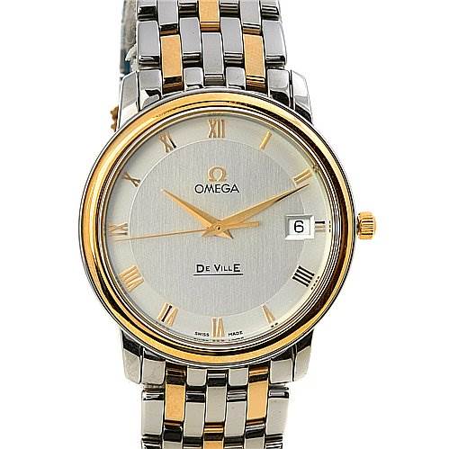 The Omega De Ville 43103200 OR 4310.   32.   00 Men's Yellow Gold White Dial 43103200 OR 4310.   32.   00 Men's Yellow Gold White Dial watch is shown from the front, displaying its face, dial, hands, date window, and part of the metal strap.