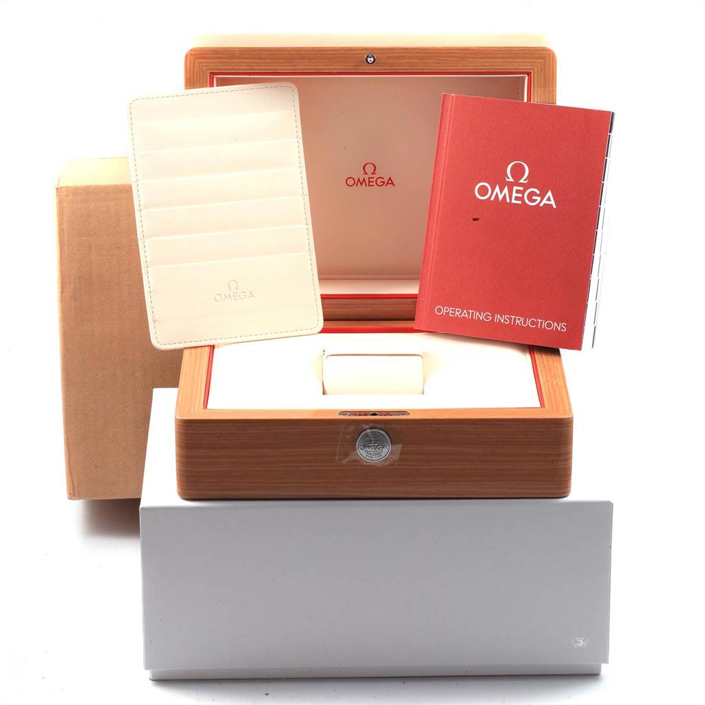 This image shows the packaging, manual, and warranty card holder for an Omega De Ville 431.10.41.21.03.001 Men's Stainless Steel Blue Dial 431.10.41.21.03.001 Men's Stainless Steel Blue Dial watch.