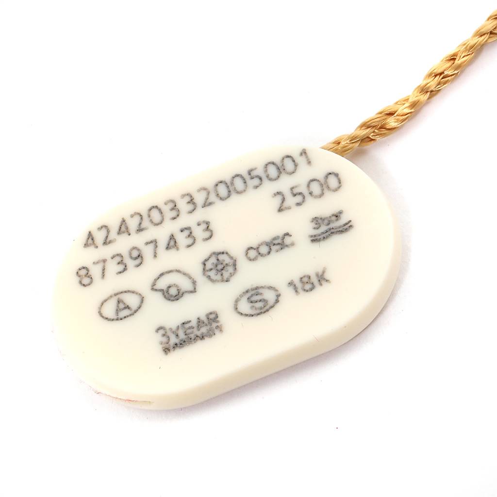 This image shows a close-up of a white tag with specifications for an Omega De Ville 424.20.33.20.05.001 Men's Steel and Gold (two tone) Mother of Pearl Dial 424.20.33.20.05.001 Men's Steel and Gold (two tone) Mother of Pearl Dial model watch.