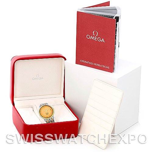 This image shows the Omega De Ville 4374.15.00 Men
s Steel and Gold (two tone) Champagne Dial 4374.15.00 Men
s Steel and Gold (two tone) Champagne Dial watch in its box, along with the operating instructions booklet.