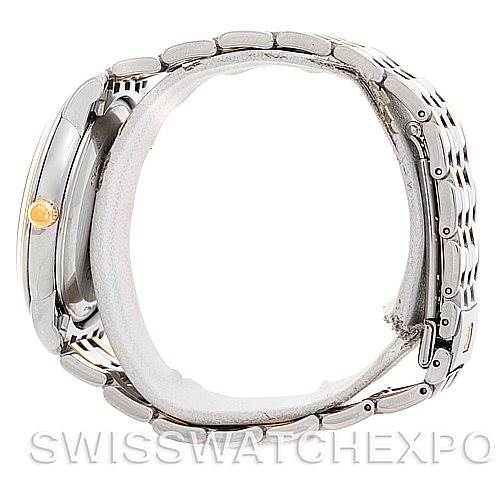 The image shows a side view of an Omega De Ville 4374.15.00 Men
s Steel and Gold (two tone) Champagne Dial 4374.15.00 Men
s Steel and Gold (two tone) Champagne Dial watch, highlighting the case, bracelet, and crown.