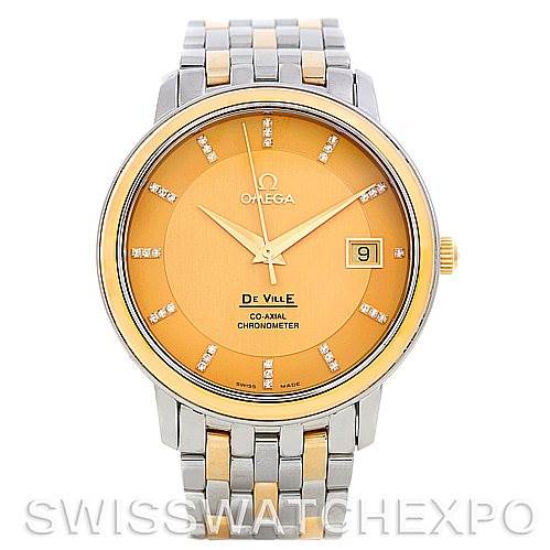 The image shows a frontal view of the Omega De Ville 4374.15.00 Men
s Steel and Gold (two tone) Champagne Dial 4374.15.00 Men
s Steel and Gold (two tone) Champagne Dial watch, highlighting the dial, hands, date display, and bracelet.