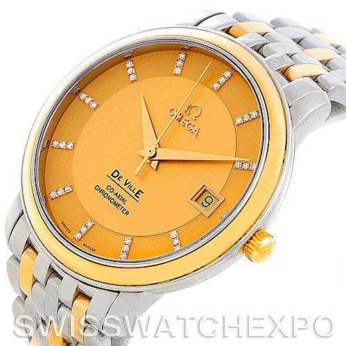 This is a close-up angle of an Omega De Ville 4374.15.00 Men
s Steel and Gold (two tone) Champagne Dial 4374.15.00 Men
s Steel and Gold (two tone) Champagne Dial watch, showing the face, hands, date window, and part of the two-tone bracelet.