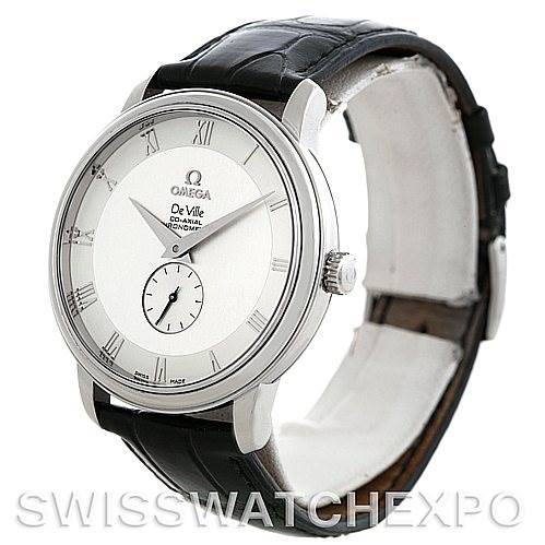 This image shows a De Ville model Omega watch at a slight angle, highlighting the face, case, bezel, and part of the leather strap.