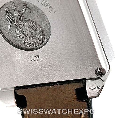 The image shows the back case of an Omega De Ville 7813.50.31 Men's Stainless Steel Black Dial 7813.50.31 Men's Stainless Steel Black Dial watch, highlighting the embossed emblem, model number, and part of the leather strap.