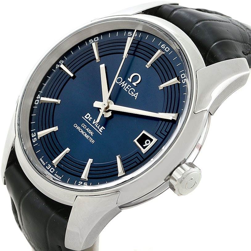The image shows an angled view of the Omega De Ville 431.33.41.21.03.001 Men
s Stainless Steel Blue Dial 431.33.41.21.03.001 Men
s Stainless Steel Blue Dial watch, highlighting its dial, crown, and part of the strap.